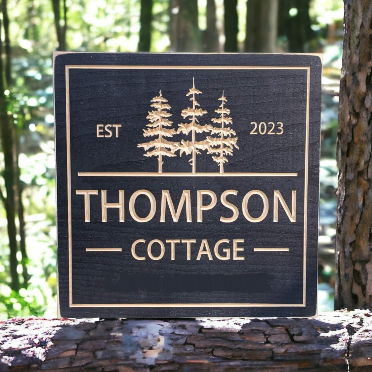 Square Cottage sign with trees