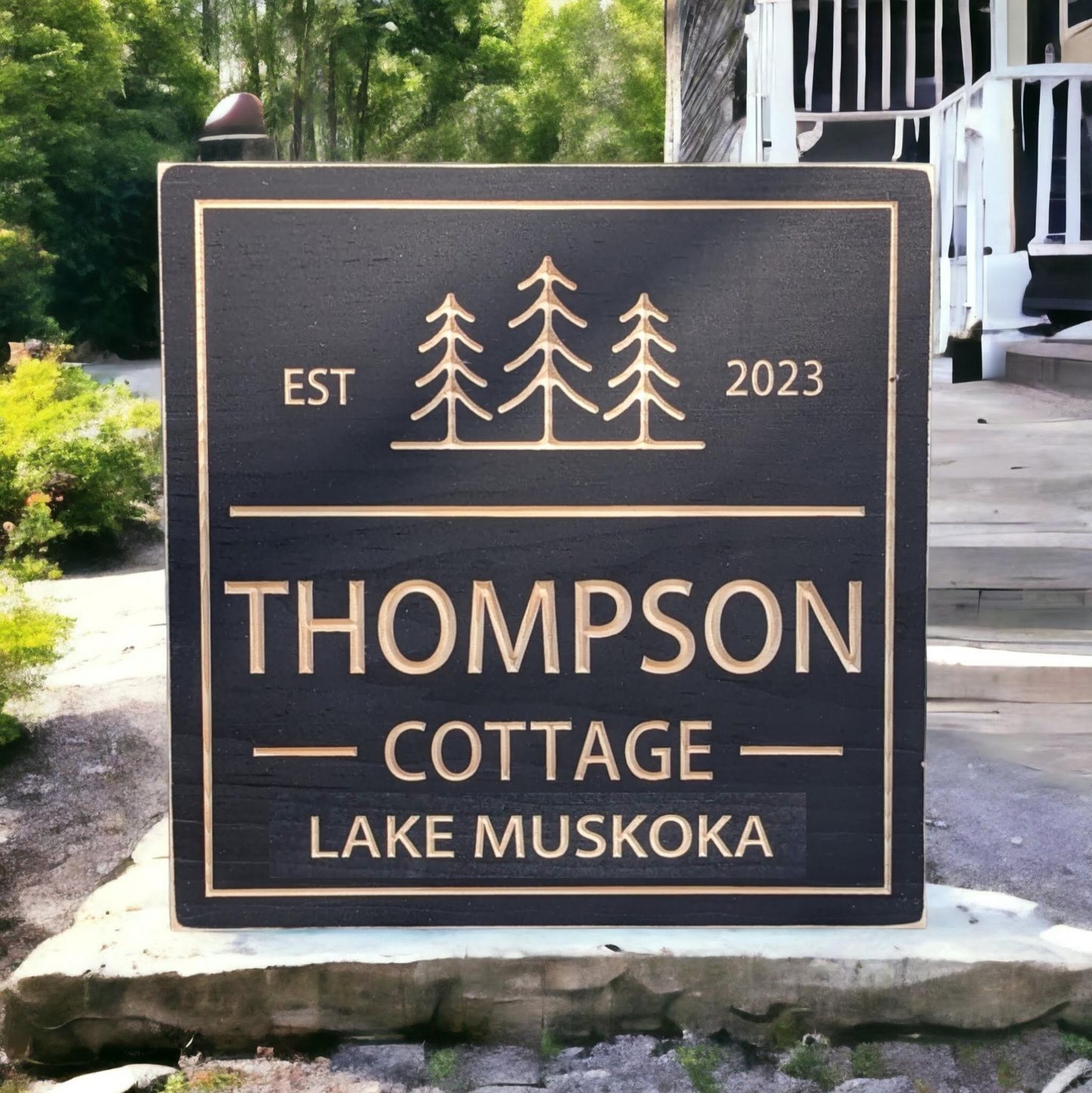 Square Cottage sign with trees
