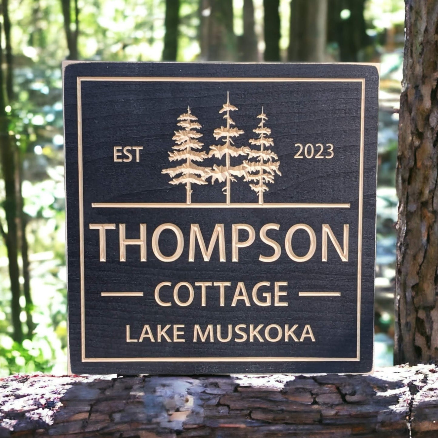 Square Cottage sign with trees