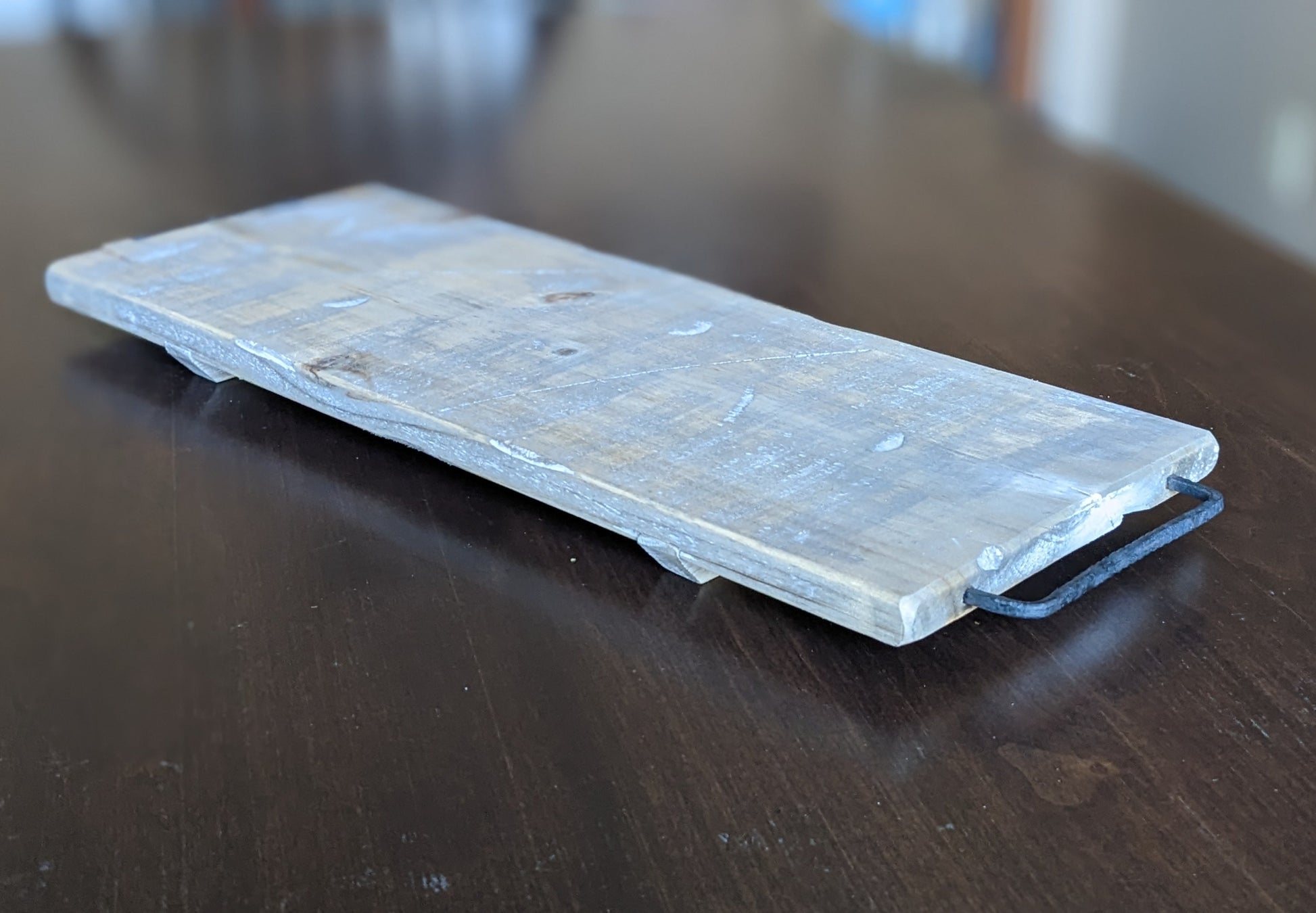 whitewashed serving board with metal handles