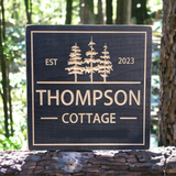 Square Cottage sign with trees