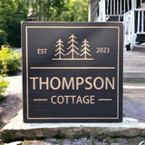 Square Cottage sign with trees