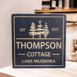Square Cottage sign with trees
