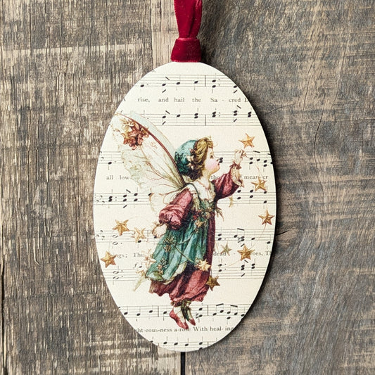 Decorative ornament with fairy design on a wooden surface