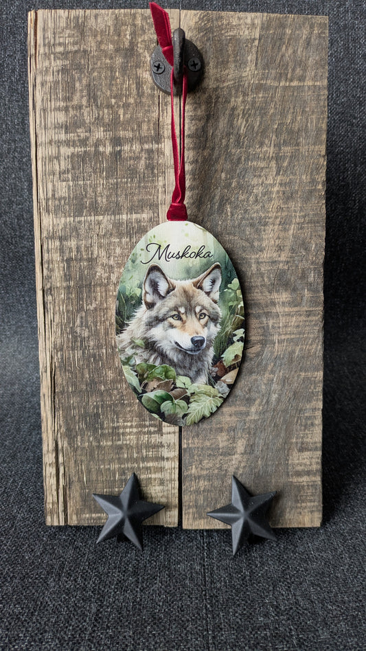 Decorative wooden ornament with a wolf illustration and 'Musikka' text on a dark background