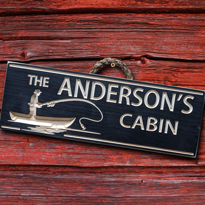 a wooden cabin sign carved and painted in black