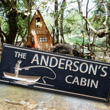 Cabin sign with a fisherman